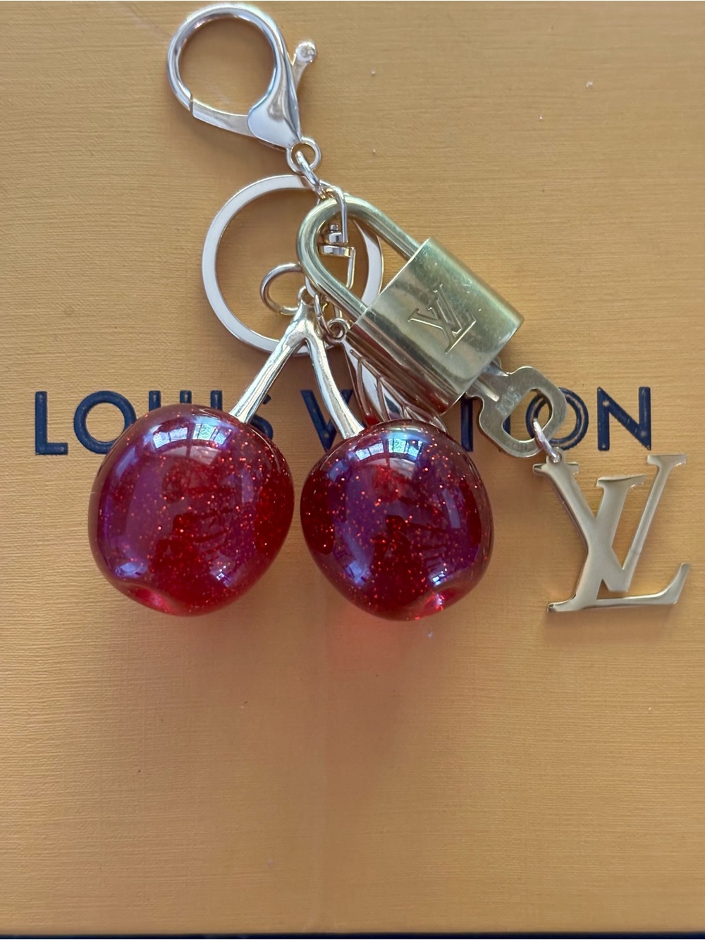 AUTHENTIC LOUIS VUITTON
BRASS LOCK & KEY #304, LARGE RED CHERRY BAG CHARM, 6 in